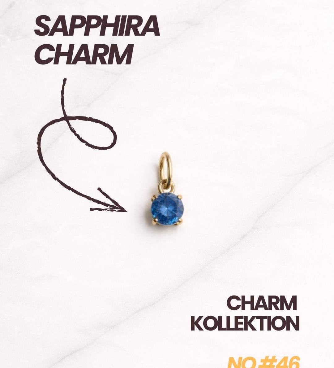Eleganter Sapphira Charm für Damen in Gold mit rundem blauem Schmuckstein.