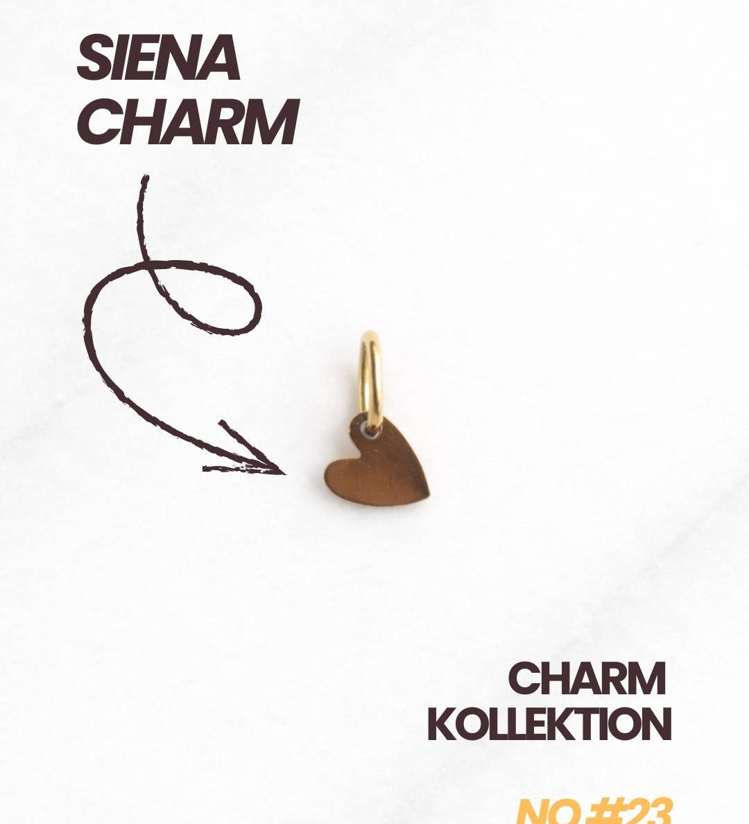 Detailaufnahme des Siena CHARM in Gold, filigraner Herzanhänger als Geschenk für Freundin.