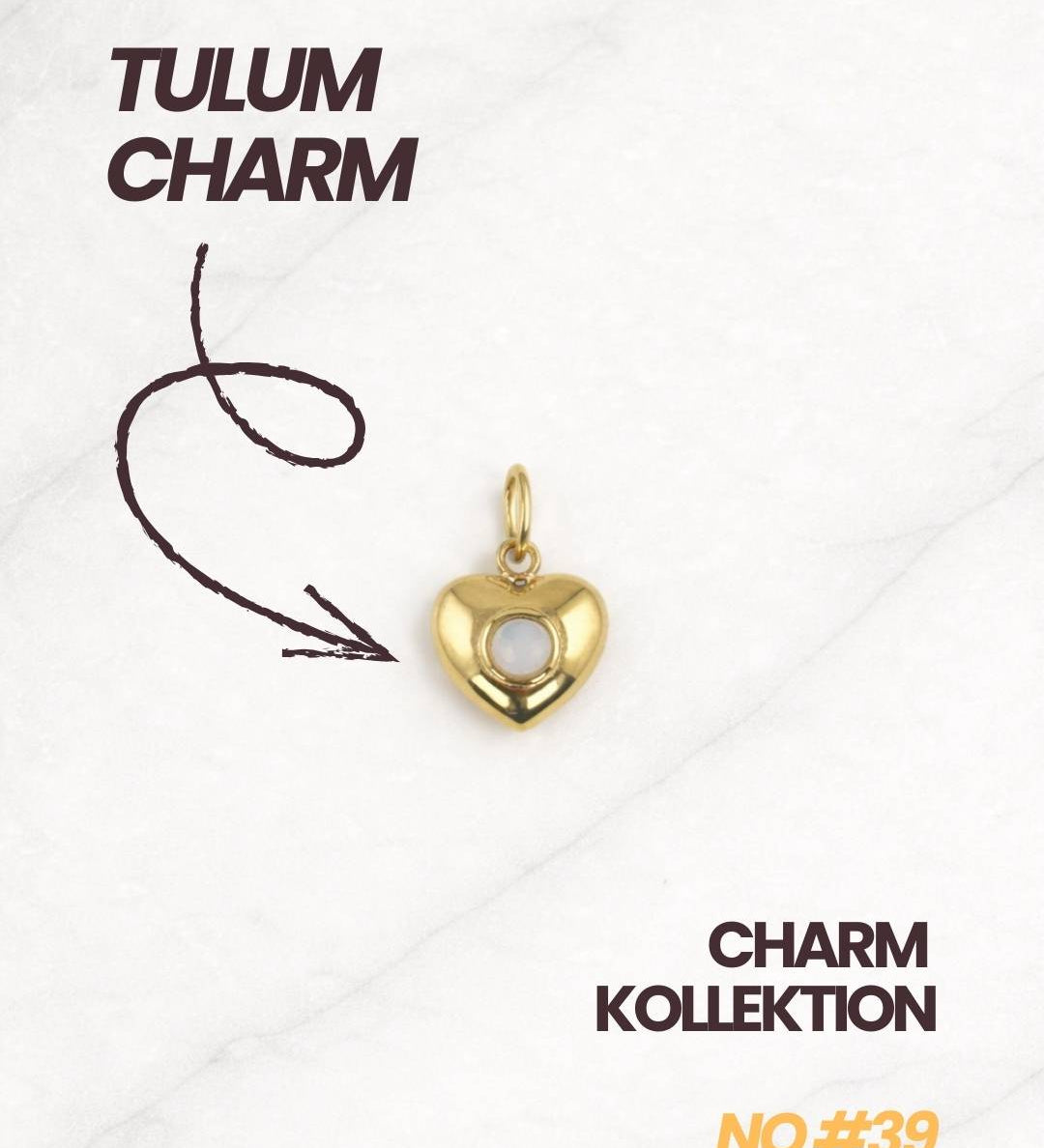 Tulum Charm aus der Charm Kollektion in Gold mit weißem Stein.
