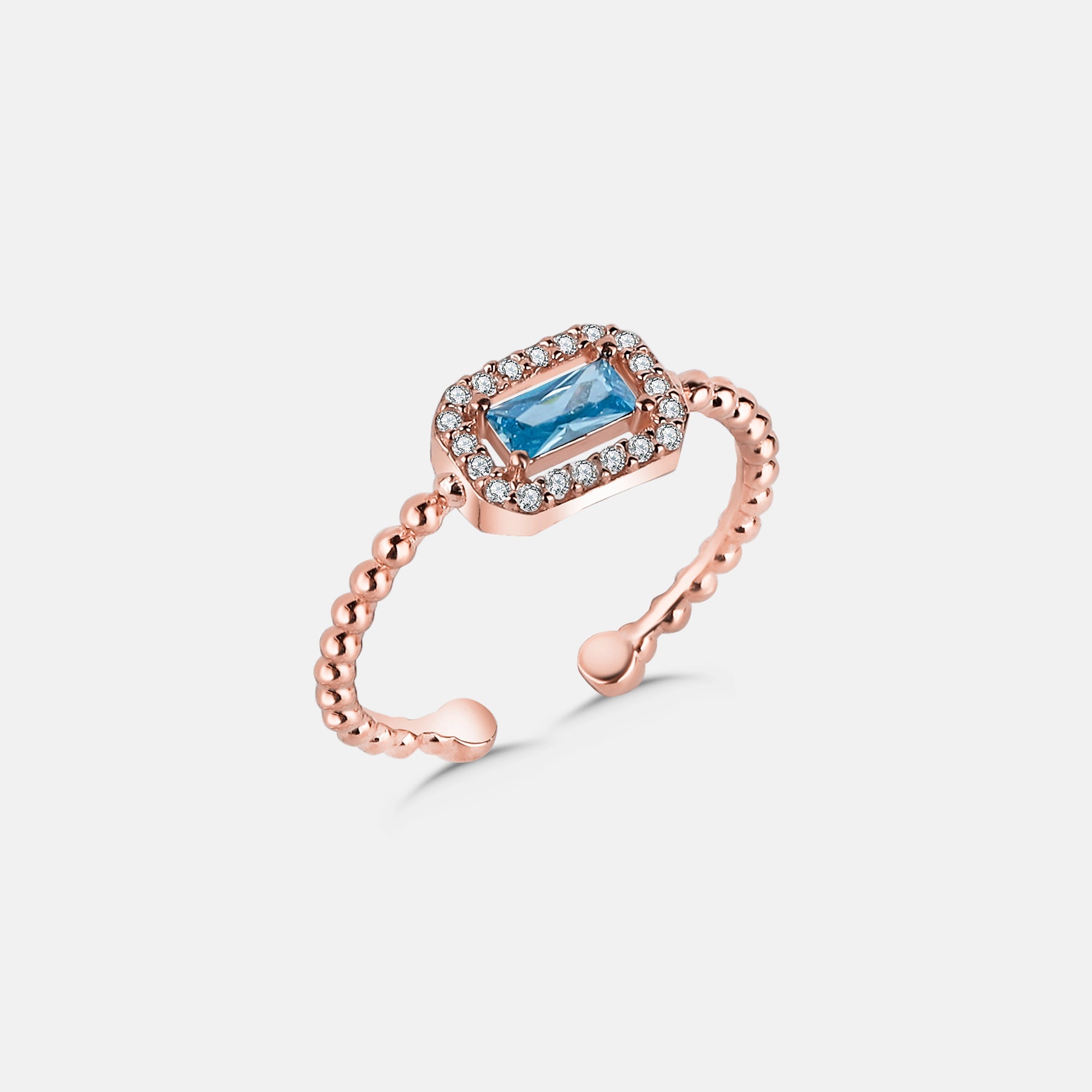 Rosévergoldeter Baguette Light Blue Ring mit hellblauem Stein und funkelnden Zirkonia von Dkeniz.