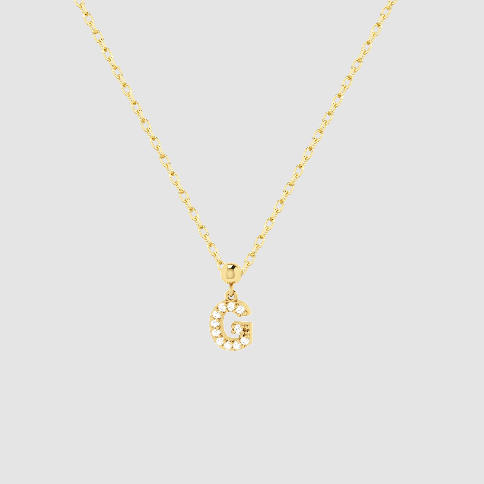 Feine goldene Halskette mit funkelndem Buchstaben G Zirkonia Anhänger von Dkeniz.