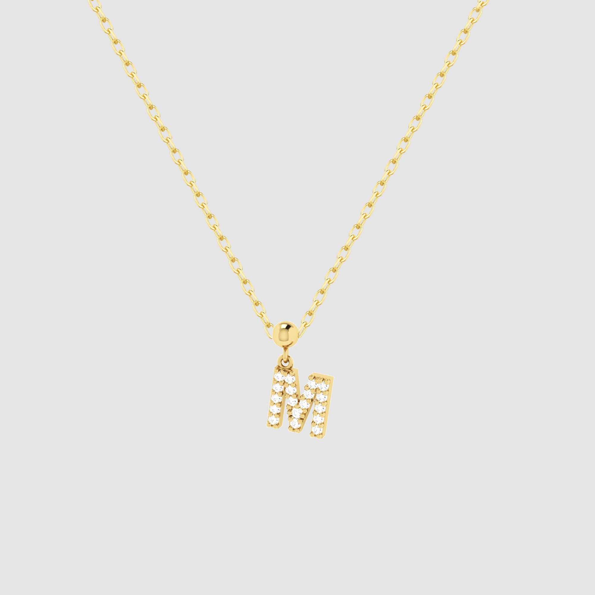 Feine goldene Halskette mit funkelndem Buchstaben M Zirkonia Anhänger von Dkeniz.
