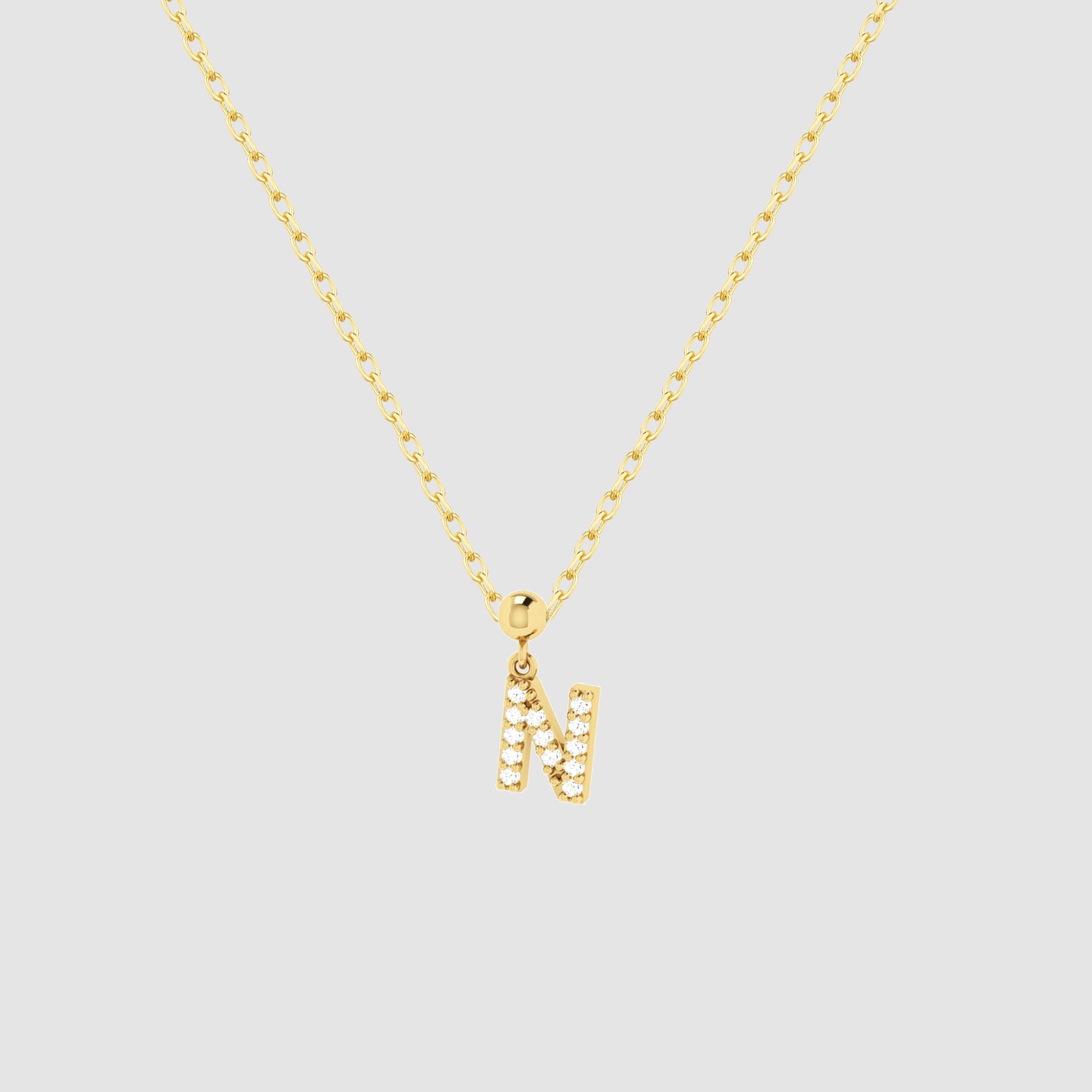 Feine goldene Halskette mit funkelndem Buchstaben N Zirkonia Anhänger von Dkeniz.