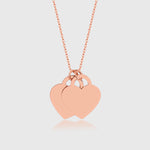 Double Heart Kette in Rosé mit zwei Herzanhängern, zarter Damen-Halsschmuck.