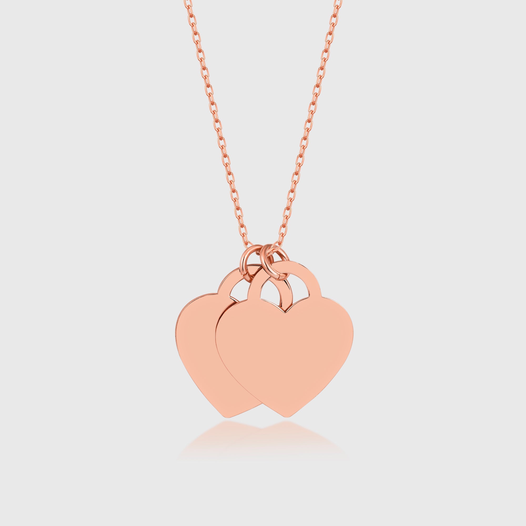 Double Heart Kette in Rosé mit zwei Herzanhängern, zarter Damen-Halsschmuck.