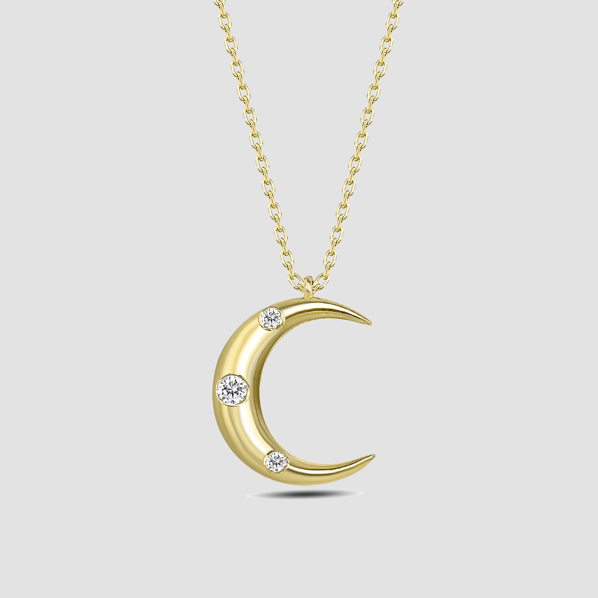 Halbmond Kette Gold mit drei Zirkonia Steinen, Mond Anhänger an feiner Kette aus 925 Silber vergoldet.