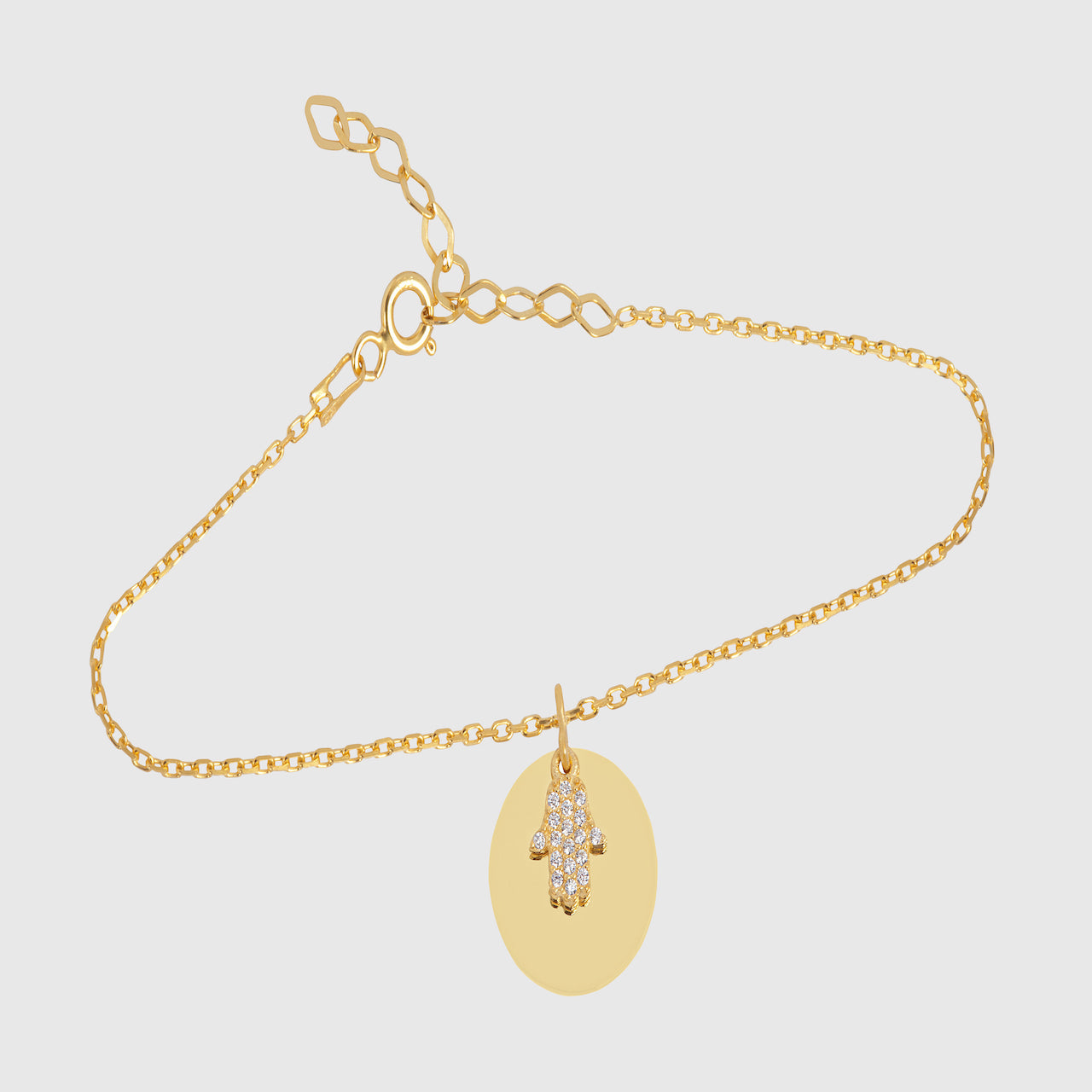 Goldene Fatima-Hand Armkette mit rundem Mirror-Plättchen, zarter Kette und Federringverschluss.