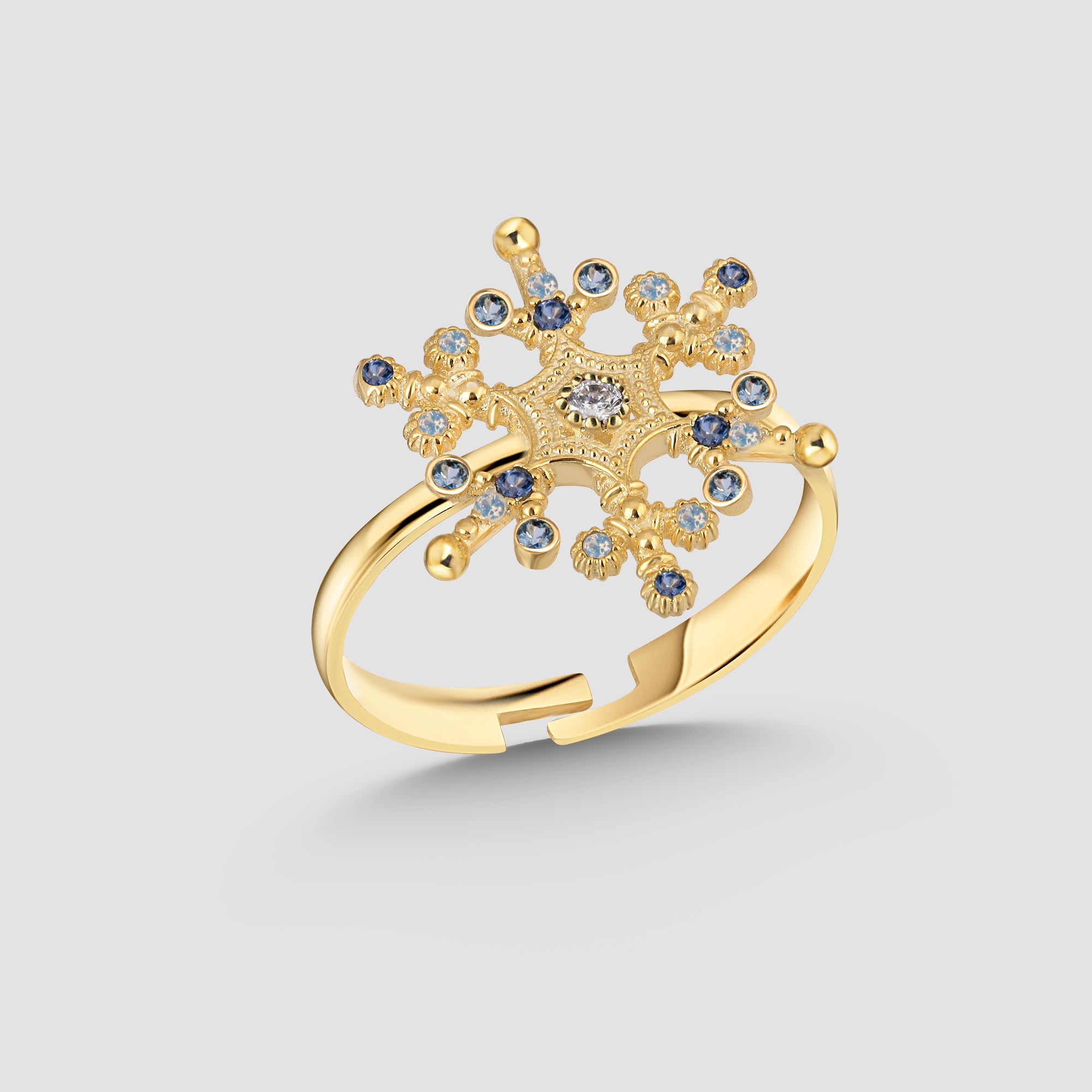 Snowflake Ice X Ring in Gold – verstellbarer Schneeflockenring mit blau-weißen Zirkonia auf 925 Silber.